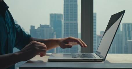 Employee begins remote tasks with stunning view, employee demonstrating efficiency and dedication, employee embracing flexible schedule, highly relevant for corporate culture footage.