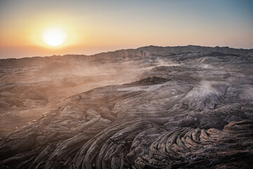 Sun setting on volcanic fumes in Erta Ale volcano in Afar region, Ethiopia