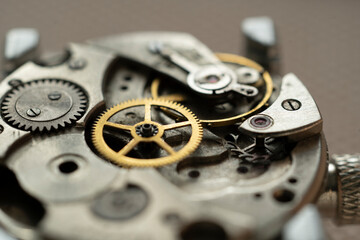 Mechanical watch assembly, watchmaker's workshop with many parts and gears
