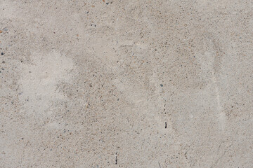 Texture of concrete with flat surface. Monolithic concrete wall or floor with sand and fine pebbles on surface, pattern, background, high resolution.