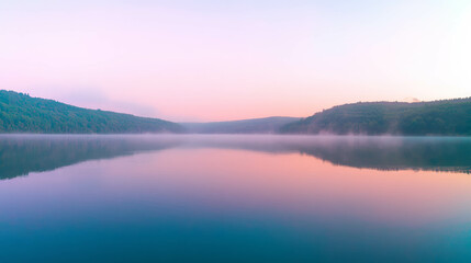 Sunrise over a misty mountain lake with captivating reflections
