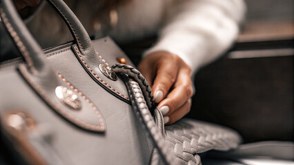 Close-up of a counterfeit luxury handbag with intricate stitching and logo details, illustrating the concept of imitation and counterfeit products in the fashion industry.