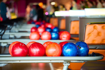 Bowling balls in a bowling club. Horizontal photo with shallow depth of field