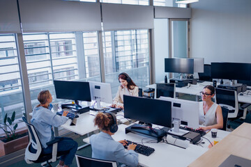 Modern Office Collaboration Features Professionals Actively Working at Their Desks