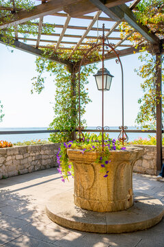 Inner garden, ancient well in Beautiful Duino castle