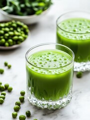 A pair of glasses containing a mysterious green substance