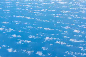 Blue sky with white clouds, flying above cloudy sky texture pattern, cloudscape blurred light