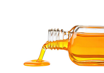 isolated transparent Background. Golden oil pouring from glass bottle, creating vibrant splash