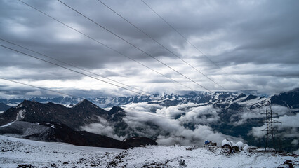 snowy mountain peaks in the clouds