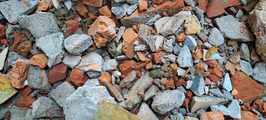 Pile of broken red bricks and fragments of concrete from destroyed building	
