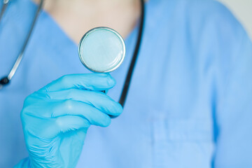 A doctor with a stethoscope in his hand conducts an examination, providing quality patient care.