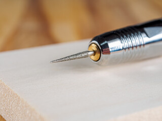 A close-up of an engraver tool, designed for carving into wood and metal. Detailed sharp,...
