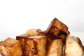 Tasty Cubes Chunks of Tofu Soy Pieces Vegan Fried Golden Cooked Close up on White Background