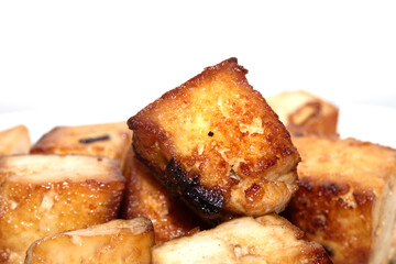 Tasty Cubes Chunks of Tofu Soy Pieces Vegan Fried Golden Cooked Close up on White Background