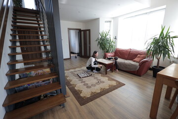 Mother and a boy spending time together playing indoors