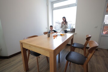 Mother and a boy spending time together playing indoors