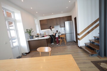 Mother and a boy spending time together playing indoors