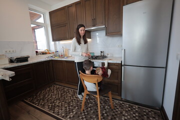 Mother and a boy spending time together playing indoors