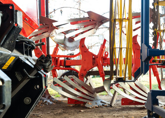 Farm equipment stored in a shed.