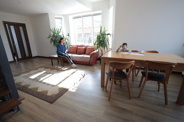 Mother and a boy child play together indoors