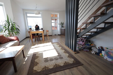 Mother and a boy child play together indoors