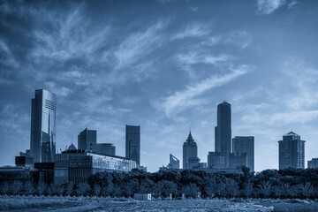 Stunning Blue-Toned Urban Skyline Under Dramatic Clouds