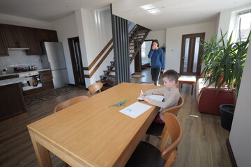 Mother and a boy child play together indoors