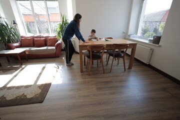 Mother and a boy child play together indoors