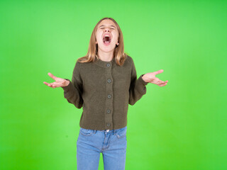 beautiful caucasian girl wearing striped sweater crazy and mad shouting and yelling with aggressive...