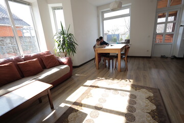 Mother and a boy child play together indoors