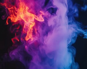 Obraz premium Colorful smoke swirls on black background (1)