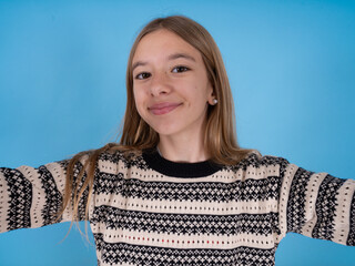 Photo of beautiful caucasian girl wearing striped sweater do selfie
