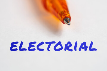 Electorial inscription term on paper pen background