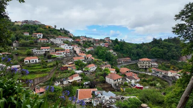View from footpath along irrigation channel called levada in Camacha city on Madeira Island, Portugal