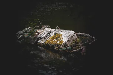the wreck of a boat bathed by the sea of northern Scotland