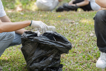 Environmental stewardship. Volunteers focusing on waste collection in the park.