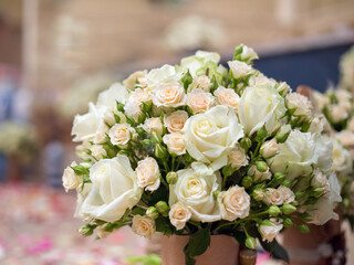 Bouquet of light pink and white roses. Wedding party in a marine style.
