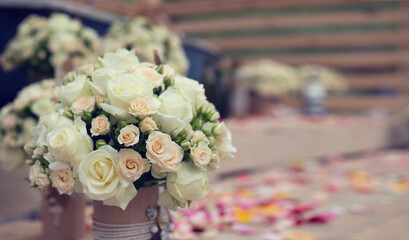 Bouquet of light pink and white roses. Wedding party in a marine style.