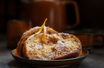 Torrijas de Semana Santa - traditional homemade Spanish dessert with orange sirup in Easter
