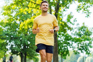 Jogging through a vibrant park in sunny weather with trees and greenery in the background