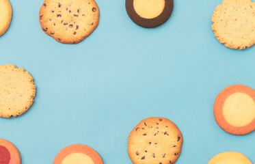 Cookies frame on light blue background.  水色背景上のクッキーのフレーム