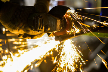 Grinder working with metal and sparks