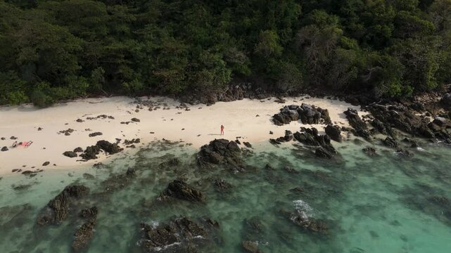 Aerial shot of a male tourist enjoying a private beach on the Phi Phi Island