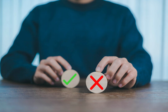 Yes or No decision idea. Checklist option communication, A man showing right or wrong icon on front wood, Decide to vote accept or not, making decision, True False