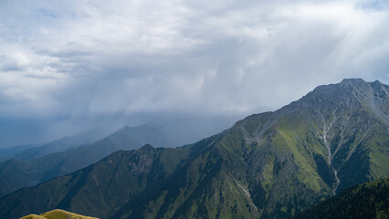 rocky mountain peaks in the clouds. cloud cover in the mountains