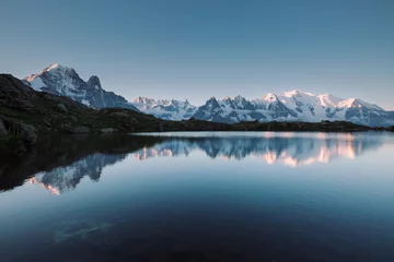 Mighty Mont Blanc massif is reflected in the calm waters of Lac Blanc. Location place Chamonix resort, Graian Alps, France, Europe.