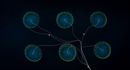 Aerial view of a panoramic salmon farm with abstract geometry and beautiful patterns in water, Sorstraumen, Troms, Norway.
