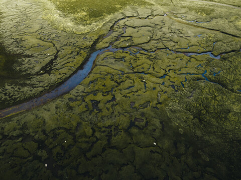 Aerial view of beautiful highlands with serpentine river and wetlands, Isle of Skye, Scotland, United Kingdom.