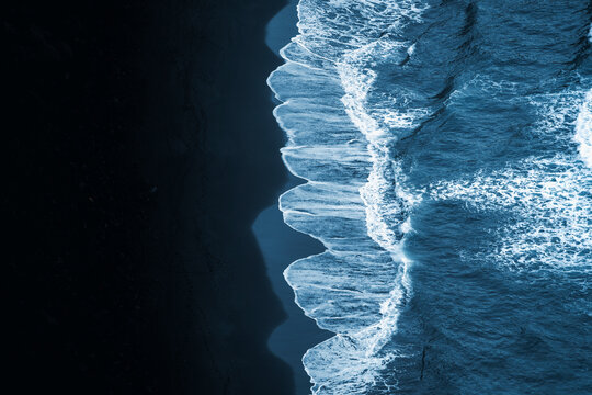 Aerial view of serene and picturesque waves crashing on the tranquil shore of a beautiful beach, Mirador de la Playa de Nogales, Santa Cruz de la Palma, Canary Islands, Spain.