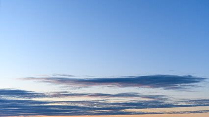 Clouds lined in a blue dawn sky